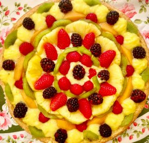 fruits tart with strawberries, pineapples, kiwis, and raspberries